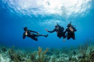 freediver and scuba diver underwater