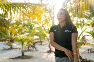 female PADI dive instructor on beach