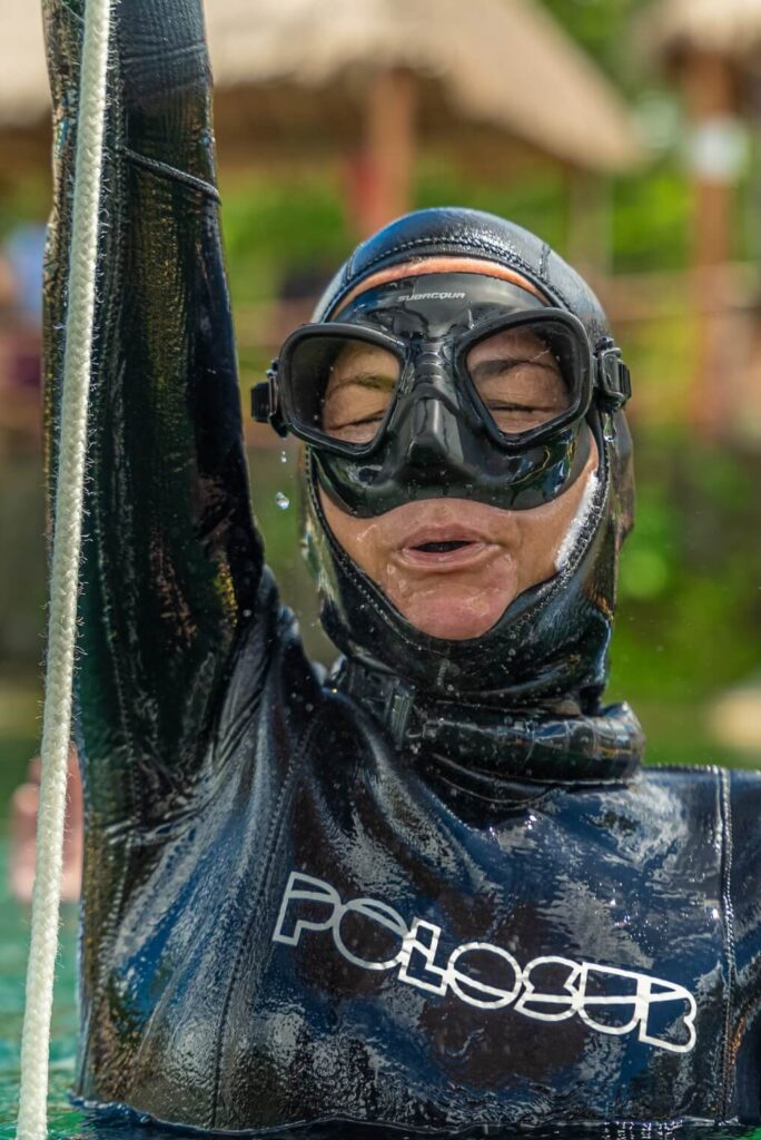 Jo surfacing in her first freediving competition The Go Pro Family
