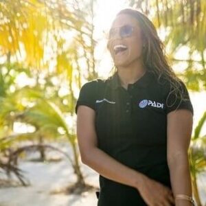 female PADI instructor smiling on beach