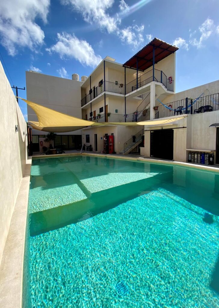 Dive center with large, clear swimming pool and 3 storey building
